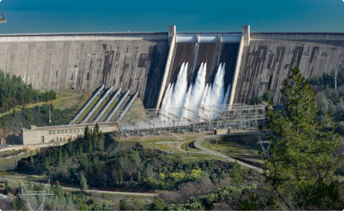 picture-shasta-dam-surrounded-by-roads-trees-with-lake-mountains